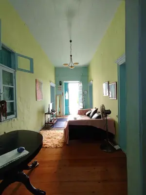 a bedroom with a bed and a table in it at Sunny apartment next to the Acropolis in Athens