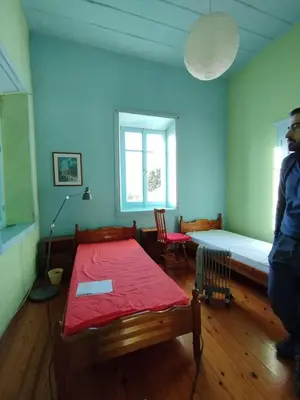 a room with a bed and a table in it at CuteStudio in Athens
