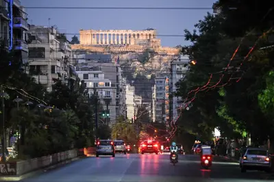 a busy city street with cars and vehicles on the road at Erato Pedion Areos Suite by Zeus Suites in Athens