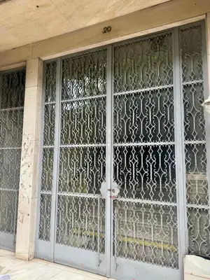 an ornate glass door of a building at Museum Pedion Areos Family Suite by Zeus Suites in Athens