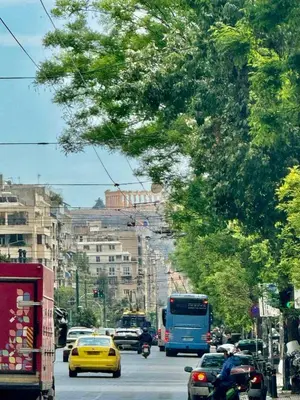 a busy city street filled with lots of traffic at Museum Pedion Areos Family Suite by Zeus Suites in Athens