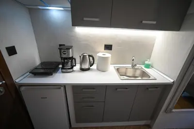 a kitchen counter with a coffee maker and a sink at Zeus Elegant Suite by Zeus Suites in Athens