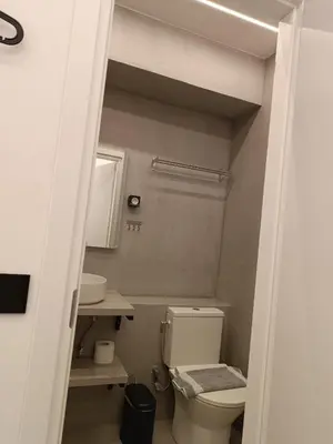 a bathroom with a toilet and a sink at Zeus Elegant Suite by Zeus Suites in Athens