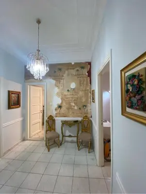 a hallway with a table and chairs in a room at Athens Apartment IV in Athens