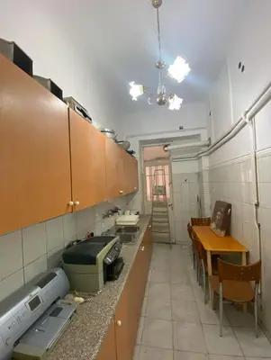 a kitchen with a counter and a table and a counter sidx sidx at Athens Apartment IV in Athens
