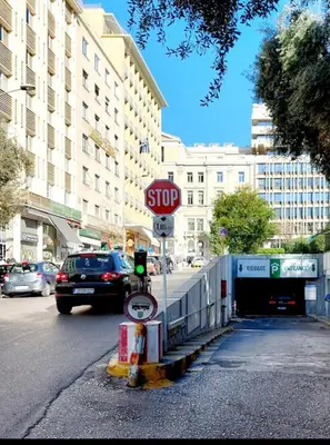 a stop sign on the side of a street at Acropolis view family big veranda by Zeussuites in Athens