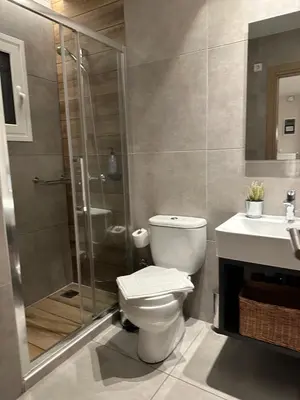 a bathroom with a toilet and a shower and a sink at Urban Muse V - Archaeological Museum of Athens in Athens