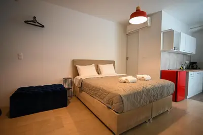 a bedroom with a bed with two stuffed animals on it at Tsakalof 10A Elegant Studio by Zeus Suites in Athens