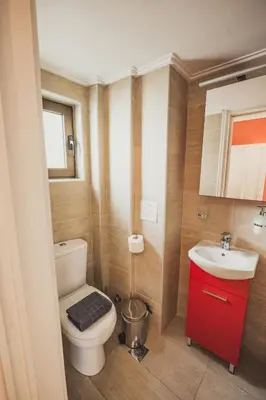 a bathroom with a toilet and a sink at Tsakalof 10 Veranda in Athens