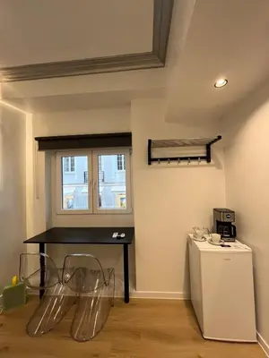 a room with a table and chairs and a window at Urban Diamond in Athens