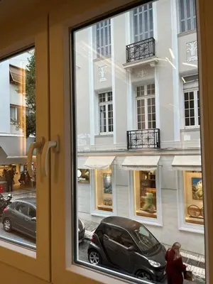 a window with a car parked in front of a building at Urban Diamond in Athens