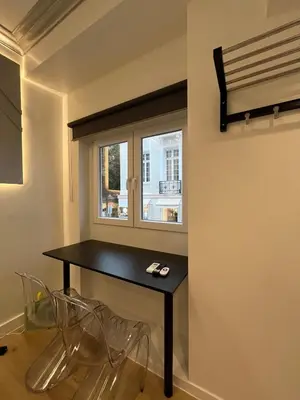 a room with a black table and a window at Fos Diamond Suite by Zeus Suites in Athens