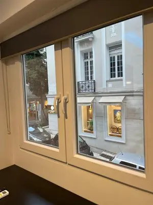 a window with a view of a building at Tsakalof 17 Jacuzzi Kolonaki Suite by Zeus Suites in Athens