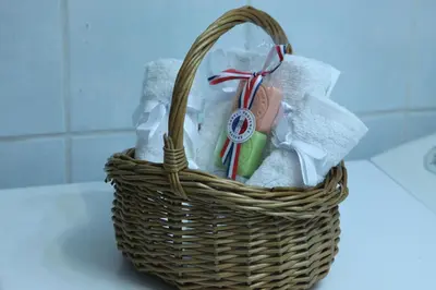a basket filled with soap and other items on a counter at Nanny's Guest House in Plaka in Athens