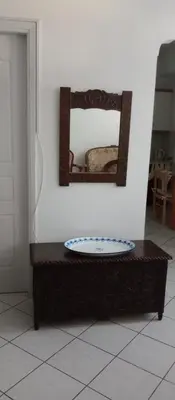a mirror on a wall above a table in a room at Nanny's Guest House in Plaka in Athens