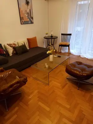 a living room with a couch and a coffee table at Kolonaki hug in Athens