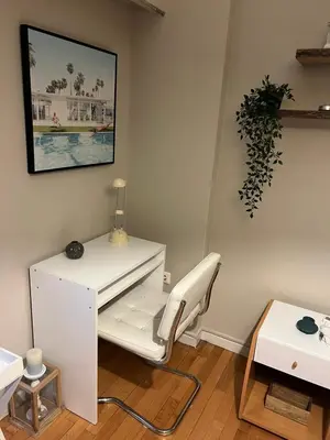 a white desk and a chair in a room at Kolonaki hug in Athens