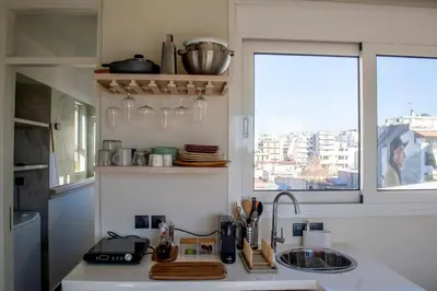 a kitchen with a sink and a window at Studio with Acropolis View at Platia Avdi in Athens
