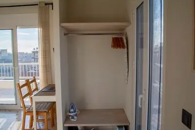 a room with a desk and a table and a window at Studio with Acropolis View at Platia Avdi in Athens
