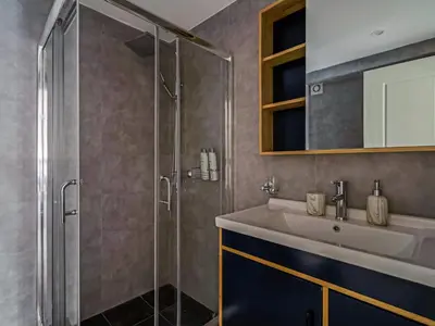 a bathroom with a sink and a shower at Central Hideaway Near Ermou Street Perfect For Groups And Families in Athens
