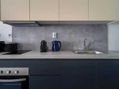 a kitchen with a sink and a counter top at Central Hideaway Near Ermou Street Perfect For Groups And Families in Athens