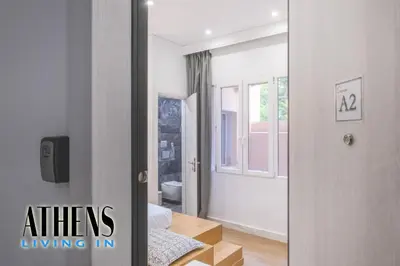 a mirror in a room with a bedroom at Classic Studio A2 - 2ppl in Athens