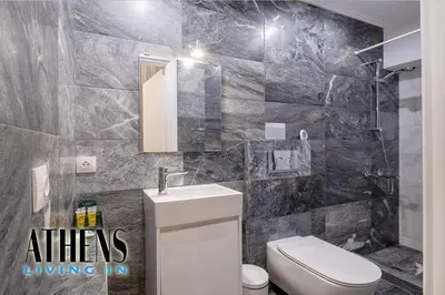 a bathroom with a white toilet and a sink at Classic Studio A2 - 2ppl in Athens
