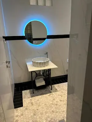 a bathroom with a sink and a mirror at Graffiti One Studio in Athens