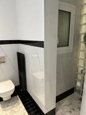 a bathroom with a toilet and a window and a shower at Graffiti One Studio in Athens