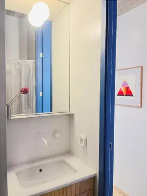 a bathroom with a sink and a mirror at Apartment in Exarchia in Athens
