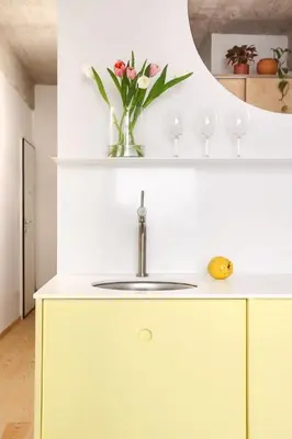 a kitchen with a sink and a vase of flowers at Apartment in Exarchia in Athens
