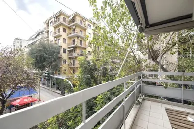 a balcony with a view of a building at Spacious and bright apt in Eksarchia in Athens