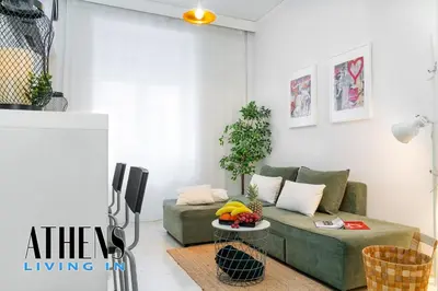 a living room with a couch and a tv at Classic Residence A1 apt - 3ppl in Athens