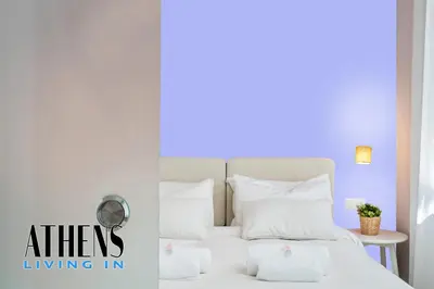 a bedroom with a bed with white pillows at Classic Residence A1 apt - 3ppl in Athens