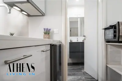 a kitchen with a sink and a microwave at Classic Residence A1 apt - 3ppl in Athens