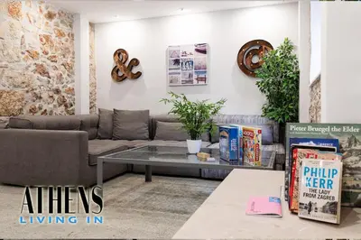 a living room with a couch and a table at Classic Residence A1 apt - 3ppl in Athens