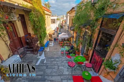 an alley with tables and chairs on a street at Classic Residence A1 apt - 3ppl in Athens