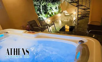 a jacuzzi tub in a hotel room with chairs at Classic Residence A3 apt 4ppl with Jacuzzi in Athens