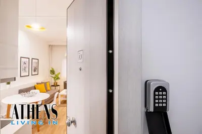 a room with a door with a remote control on it at Classic Residence A3 apt 4ppl with Jacuzzi in Athens
