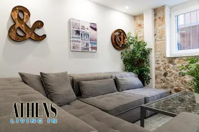 a living room with a couch and a table at Classic Residence A3 apt 4ppl with Jacuzzi in Athens