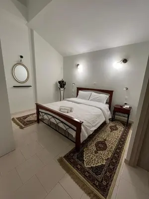 a bedroom with a large bed and a mirror at Jimilio 1 in Spáta