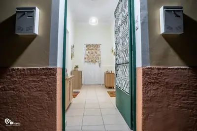 a hallway with two doors and a hallway with a door at Orchid - Stylish Home Near Piraeus in Piraeus