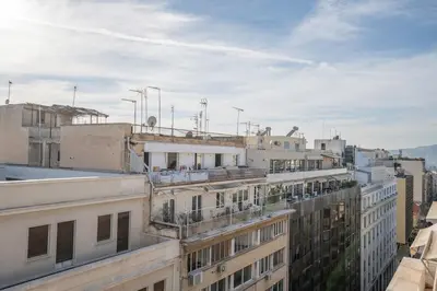 an aerial view of buildings on a city street at Sofokleous suite with Acropolis stunning view in Athens