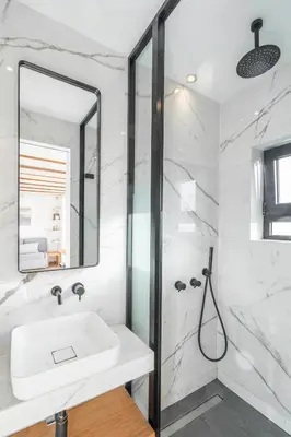 a white bathroom with a sink and a shower at Sofokleous suite with Acropolis stunning view in Athens