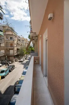 a balcony of a building with cars parked on the street at Classic Studio B1 - 3ppl in Athens