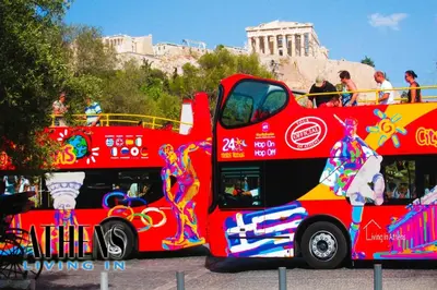 a red double decker bus parked in front of the coliseum at Classic Studio B1 - 3ppl in Athens