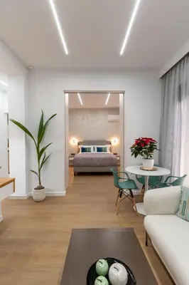 a living room with a couch and a table at Modern Niarchos Escape in Athens
