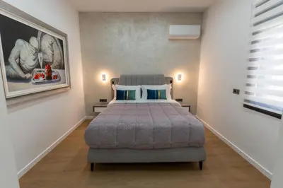 a bedroom with a large bed in a room at Modern Niarchos Escape in Athens