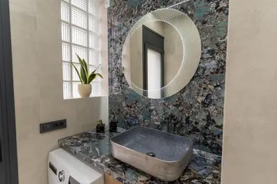 a bathroom with a sink and a mirror at Modern Niarchos Escape in Athens