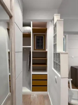 a walk in closet with white walls and shelves at Bright Gem in Vibrant Popular Neighborhood in Athens